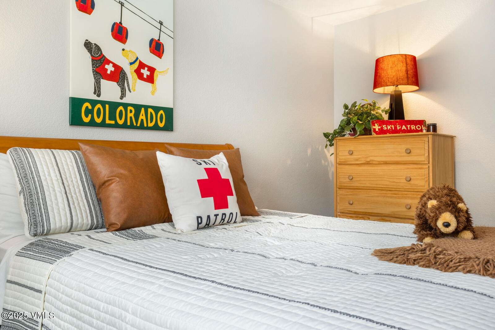 425 Deer Boulevard, Unit B Eagle-Vail, CO 81620 - Photo 18 of 26 a bedroom with a bed and a window