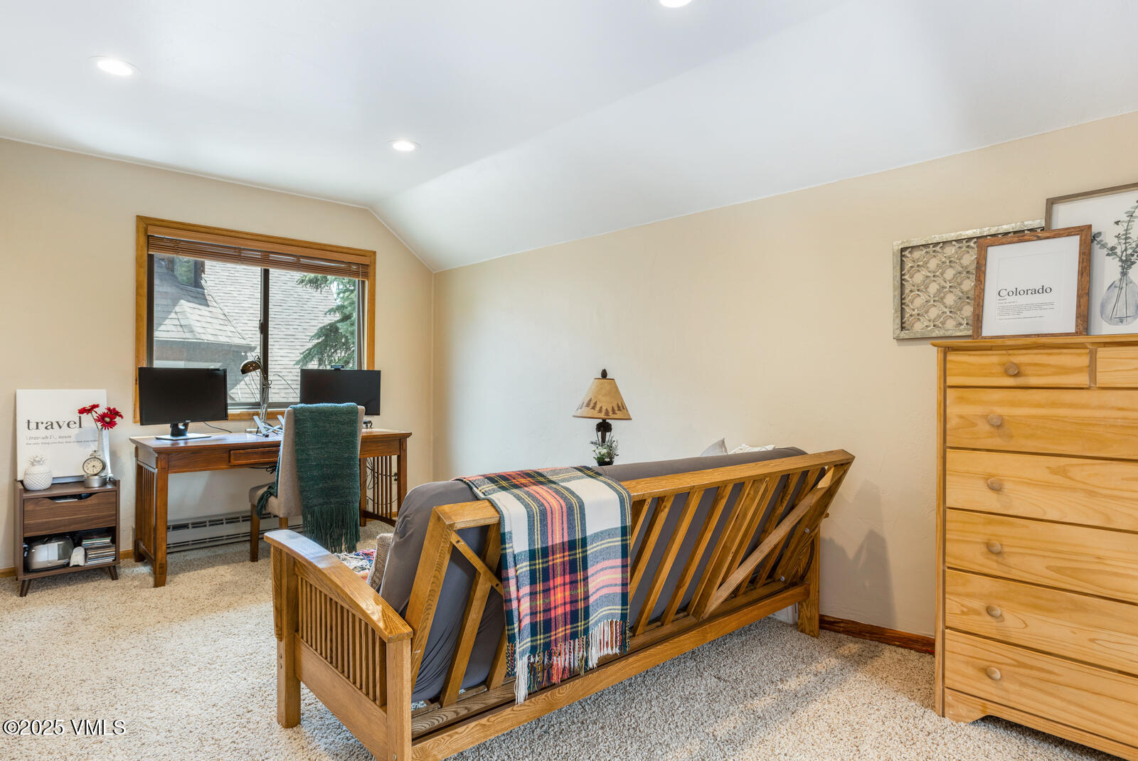 425 Deer Boulevard, Unit B Eagle-Vail, CO 81620 - Photo 21 of 26 a bedroom with a bed and a dresser
