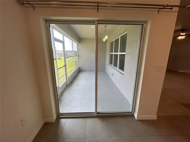 a large kitchen with stainless steel appliances a stove top oven a sink a microwave and a refrigerator