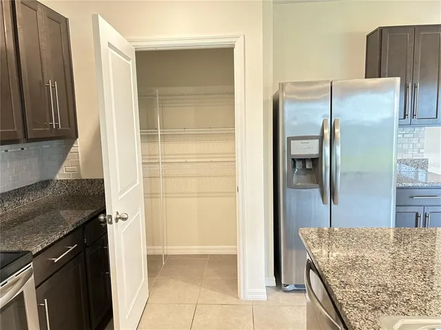a view of a hallway with a wooden door