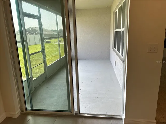 a kitchen with a sink refrigerator and microwave