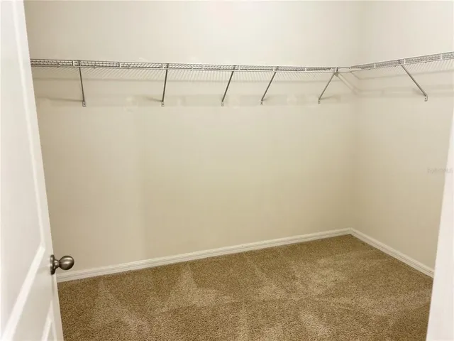 an empty room with a bathroom