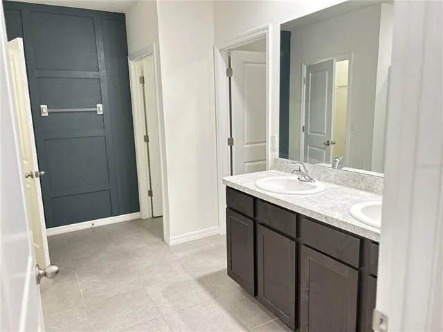a view of a livingroom with an empty space and a hallway