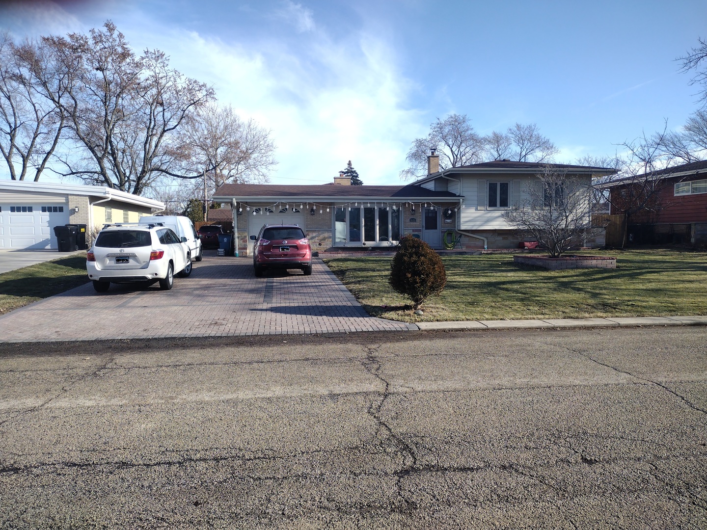 5639 Manor Lane Chicago, IL 60631 - Photo 2 of 29 a car parked in front of a house