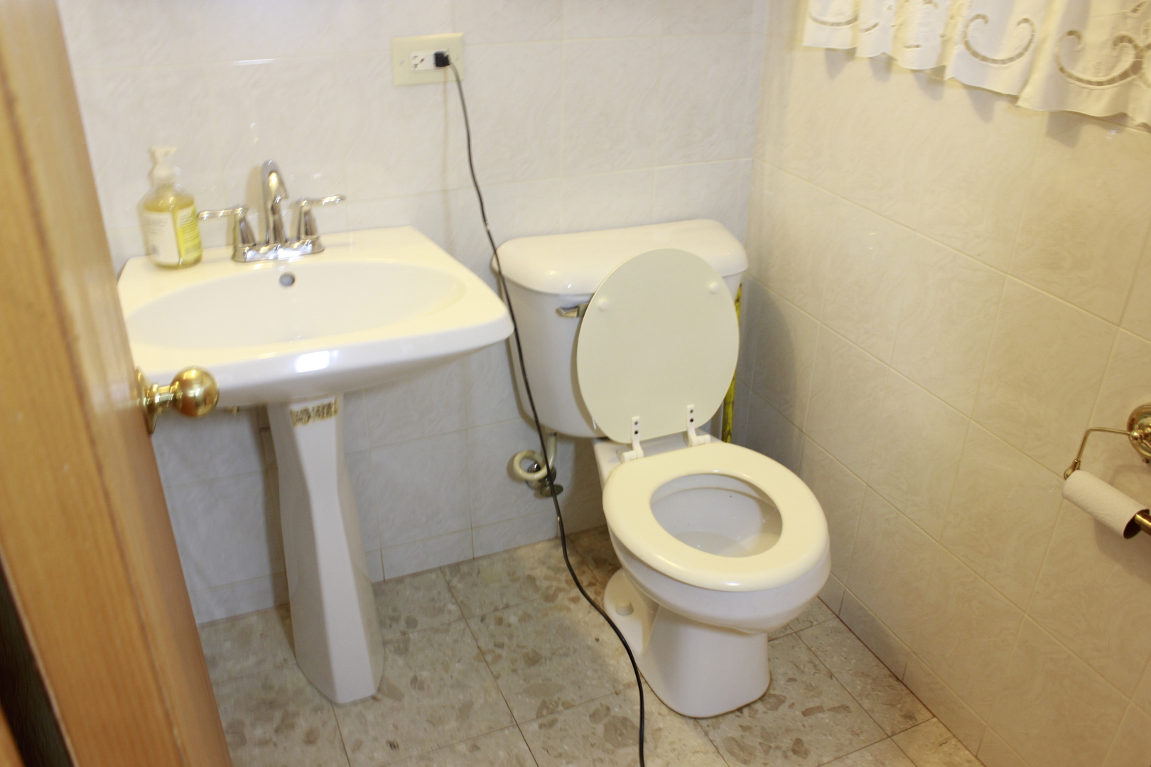 5639 Manor Lane Chicago, IL 60631 - Photo 23 of 29 a bathroom with a toilet and a sink