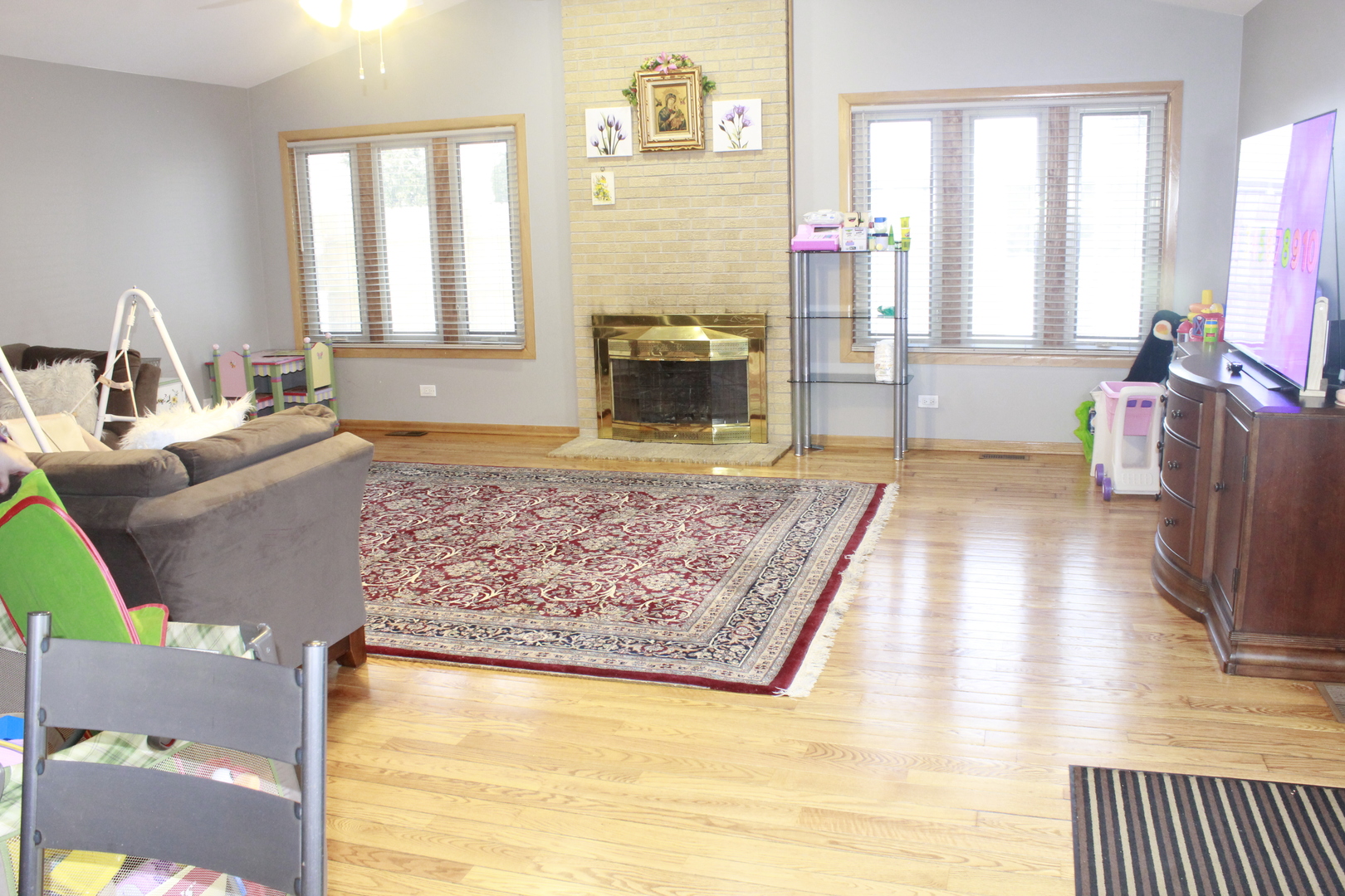 5639 Manor Lane Chicago, IL 60631 - Photo 27 of 29 a living room with fireplace furniture and a flat screen tv