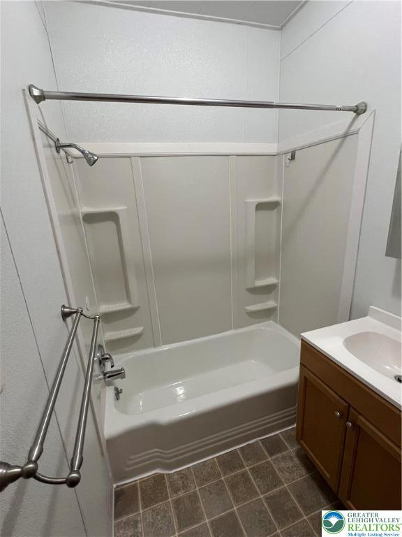 7108 Highway 873, Unit 3 Slatington, PA 18080 - Photo 16 of 19 a bathroom with a sink a mirror and a bathtub