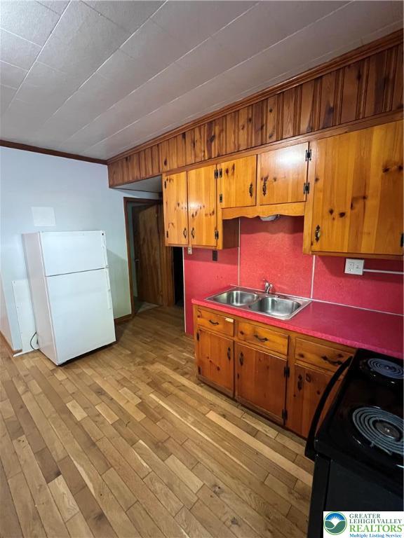 7108 Highway 873, Unit 3 Slatington, PA 18080 - Photo 19 of 19 a kitchen with stainless steel appliances wooden cabinets and a stove top oven