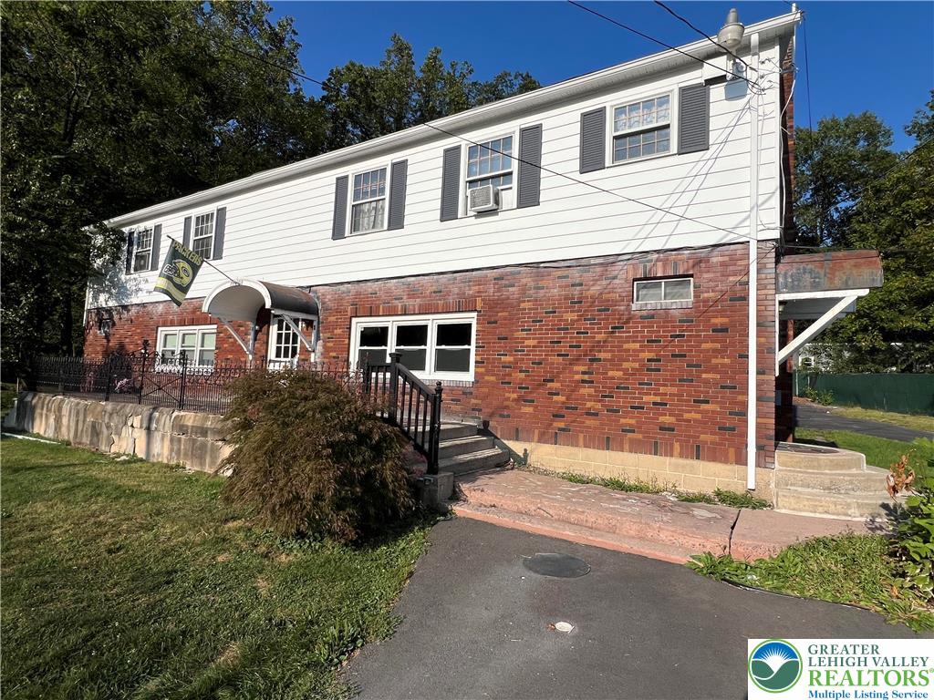 7108 Highway 873, Unit 3 Slatington, PA 18080 - Photo 2 of 19 a front view of a house with a yard