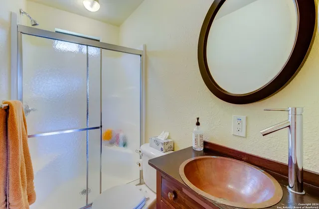 a bathroom with a sink and a mirror
