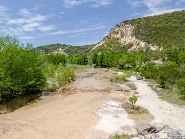 a view of a pathway with a yard