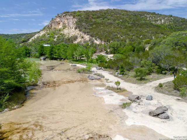 a view of a pathway with a yard