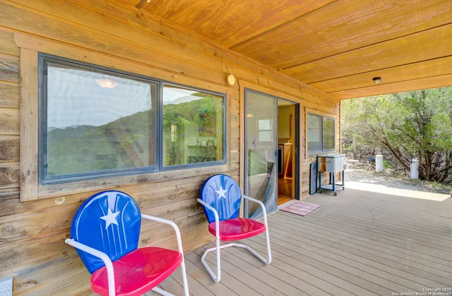 a bedroom with furniture and wooden floor