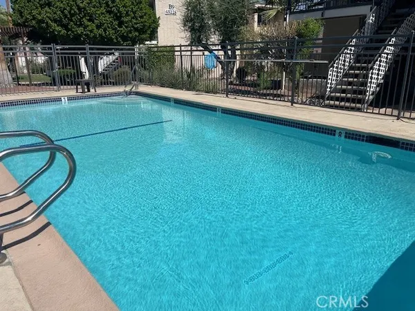 a view of a balcony with floor to ceiling windows