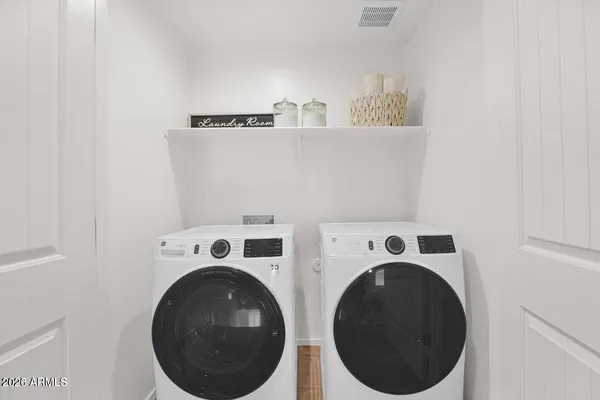 a utility room with dryer and washer