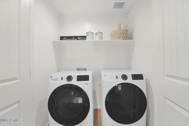 a utility room with dryer and washer