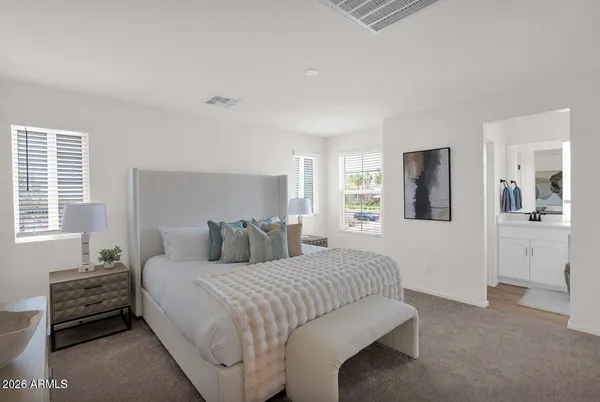 a bedroom with a bed and a cabinets