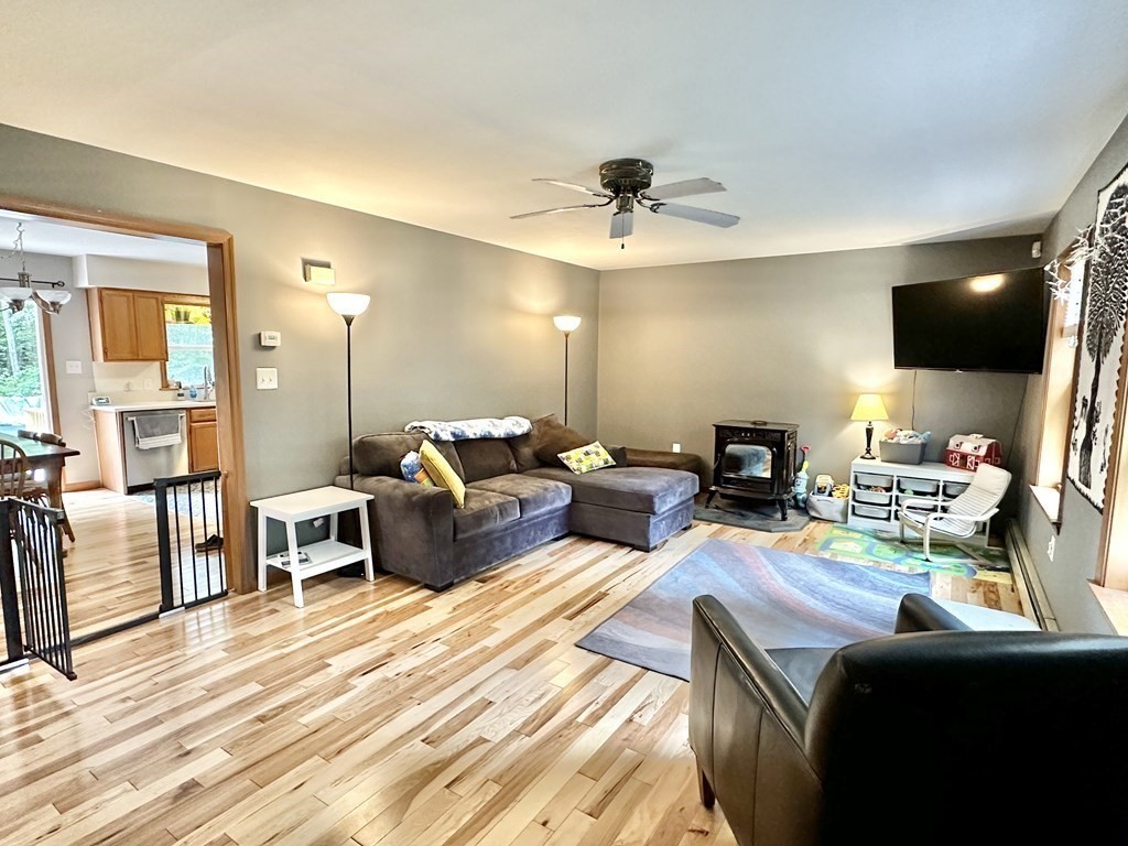 1388 Westhampton Road Northampton, MA 01062 - Photo 12 of 28 a living room with furniture and a flat screen tv