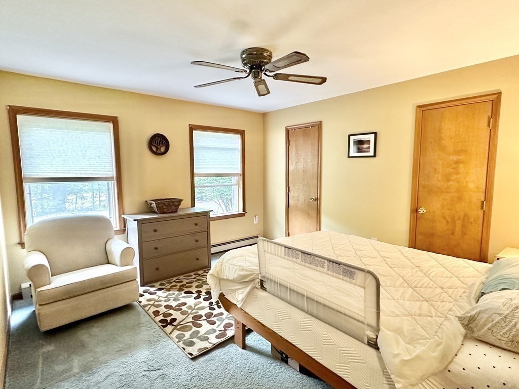 1388 Westhampton Road Northampton, MA 01062 - Photo 18 of 28 a bedroom with a couch and a window