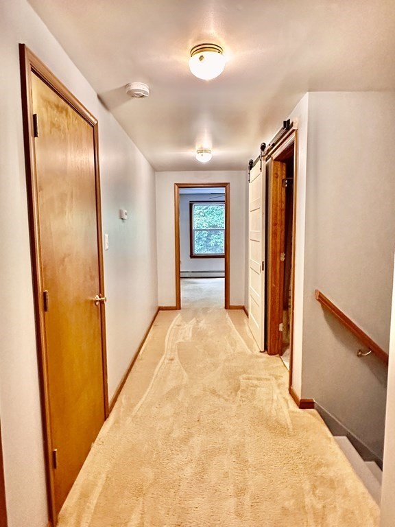 1388 Westhampton Road Northampton, MA 01062 - Photo 24 of 28 view of empty room with front door