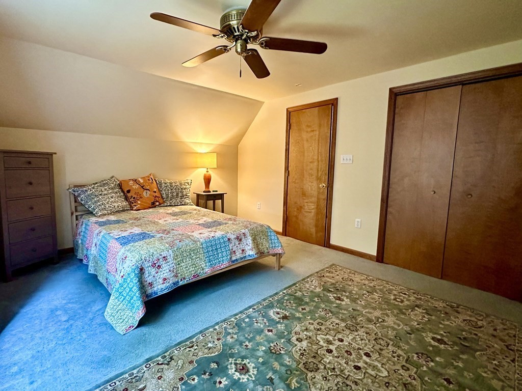 1388 Westhampton Road Northampton, MA 01062 - Photo 27 of 28 a bedroom with a bed and a walk in closet