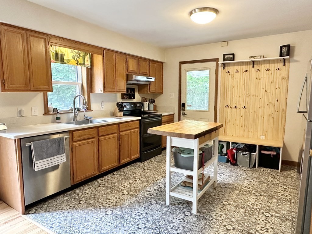 1388 Westhampton Road Northampton, MA 01062 - Photo 4 of 28 a kitchen with a stove a sink and a refrigerator
