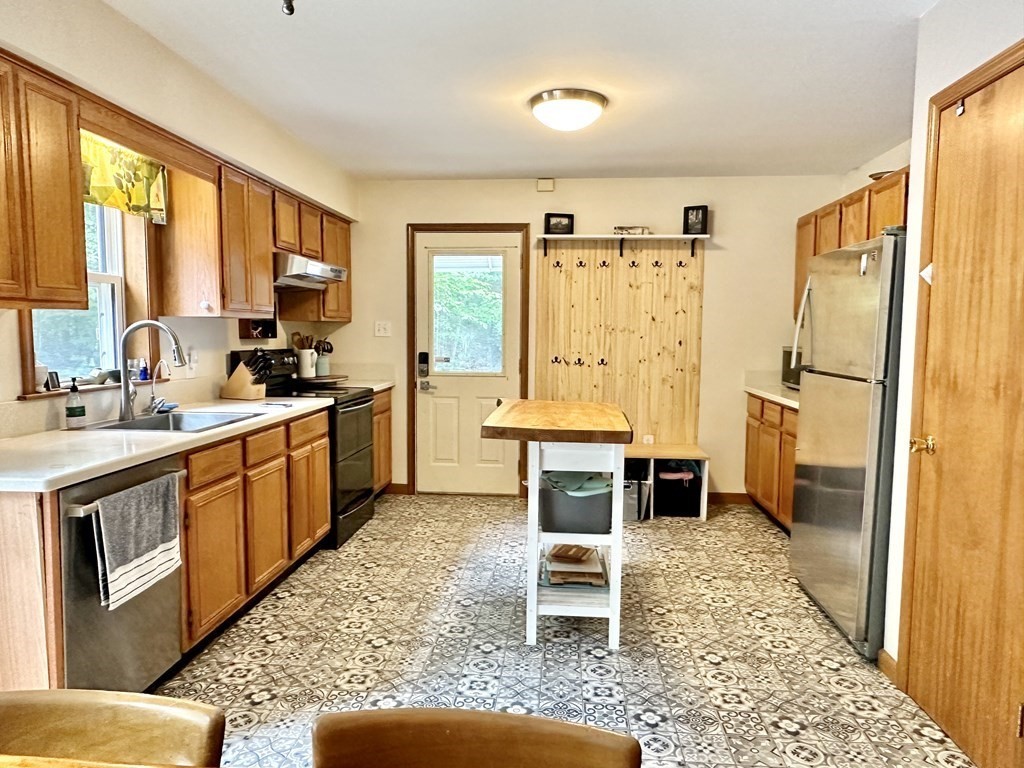 1388 Westhampton Road Northampton, MA 01062 - Photo 5 of 28 a large kitchen with stainless steel appliances granite countertop a stove a sink and a refrigerator
