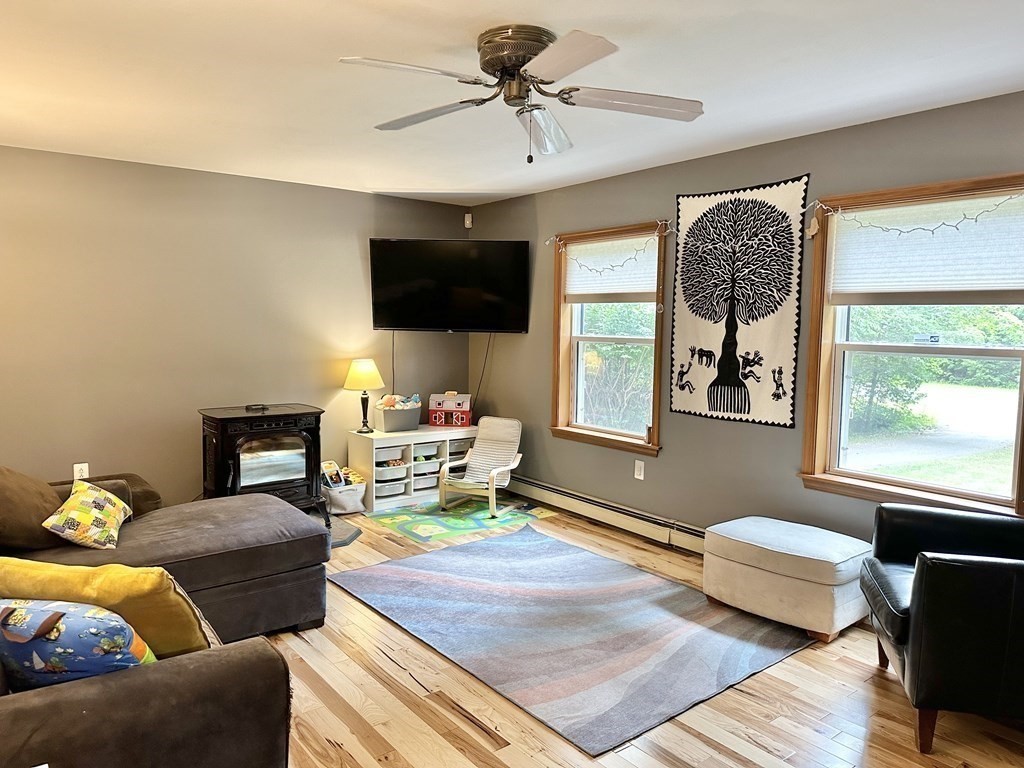 1388 Westhampton Road Northampton, MA 01062 - Photo 8 of 28 a living room with furniture and a flat screen tv