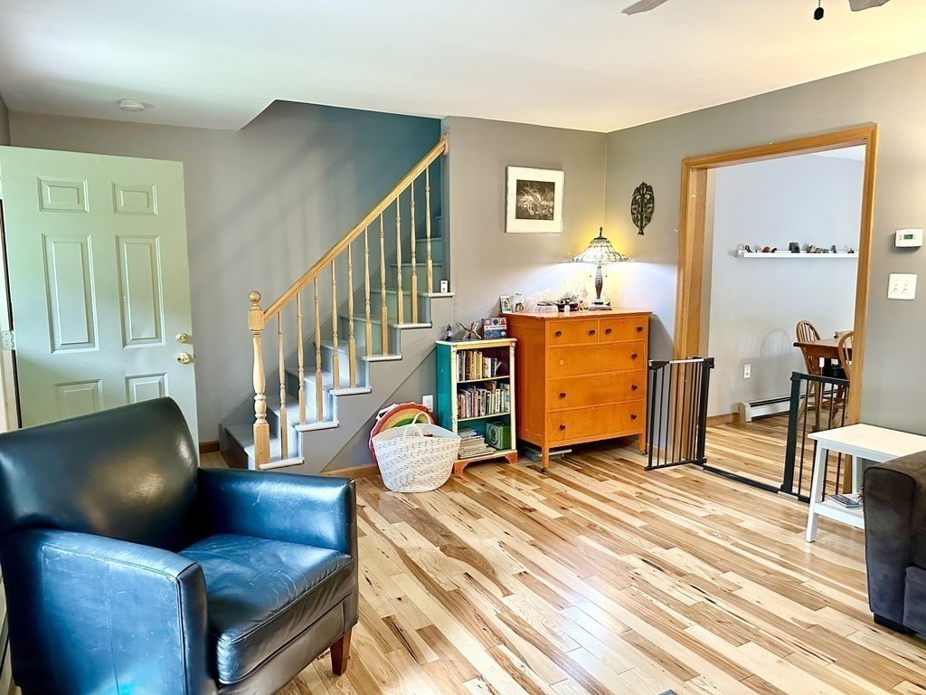1388 Westhampton Road Northampton, MA 01062 - Photo 9 of 28 a living room with furniture and a wooden floor