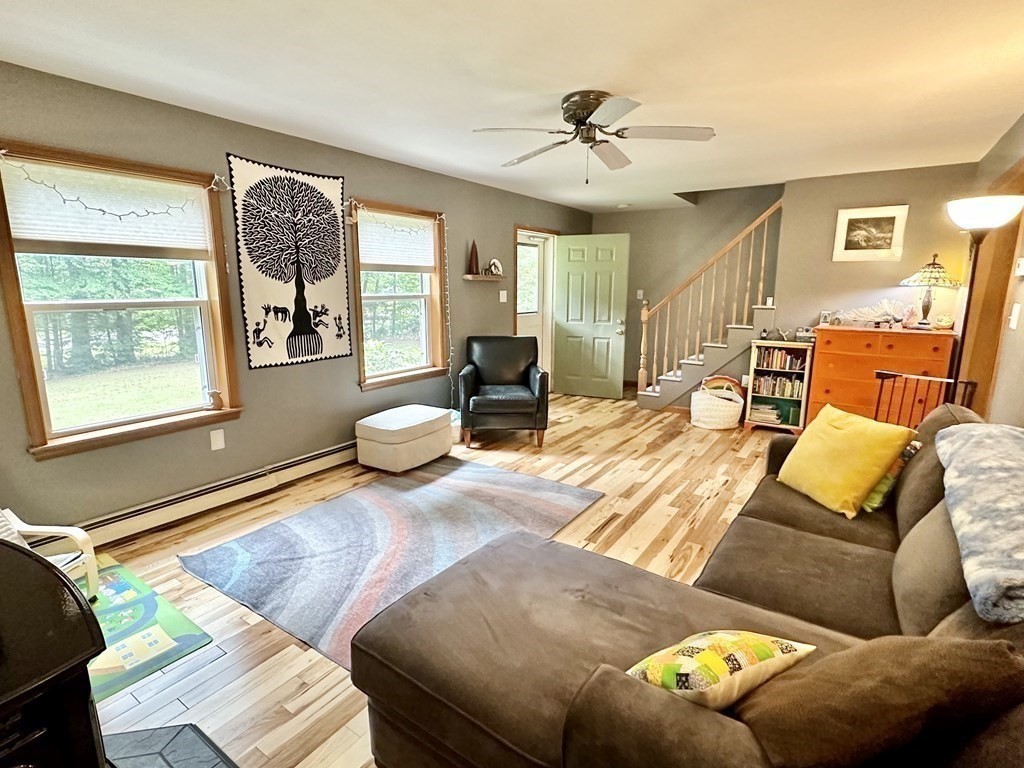 1388 Westhampton Road Northampton, MA 01062 - Photo 10 of 28 a living room with furniture and floor to ceiling windows