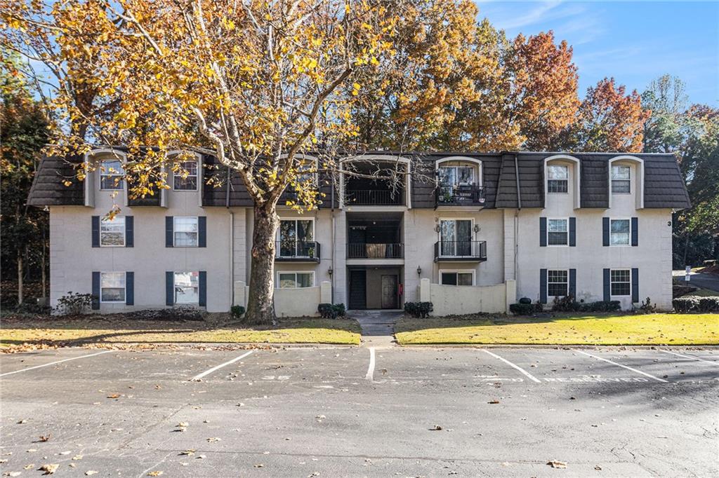 725 Dalrymple Road, Unit 3H Atlanta, GA 30328 - Photo 2 of 17 a view of a house with a swimming pool