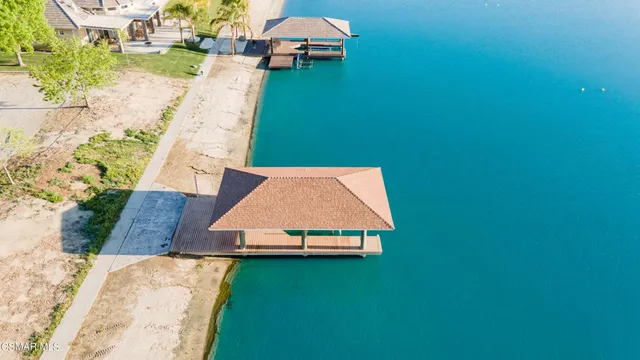 an aerial view of a house with a yard basket ball court and outdoor seating