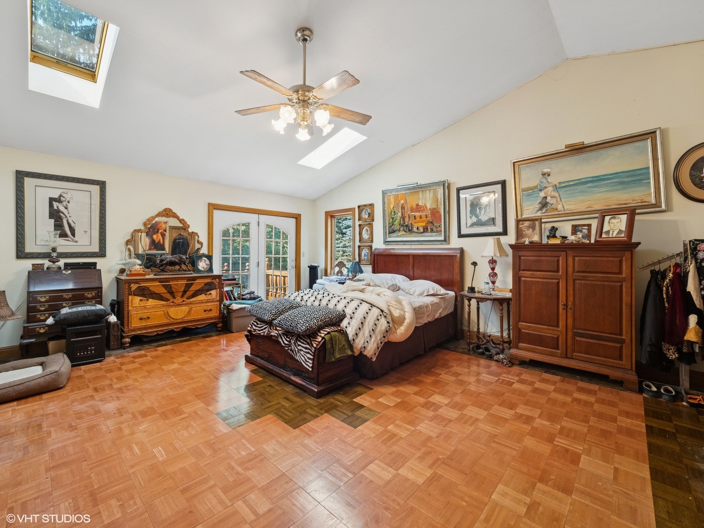 724 South Plum Grove Road Palatine, IL 60067 - Photo 12 of 37 a bedroom with a bed and a chandelier