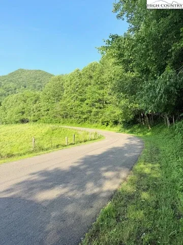 a view of a road with a yard