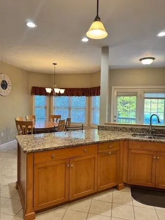 a kitchen with a sink a counter space and appliances