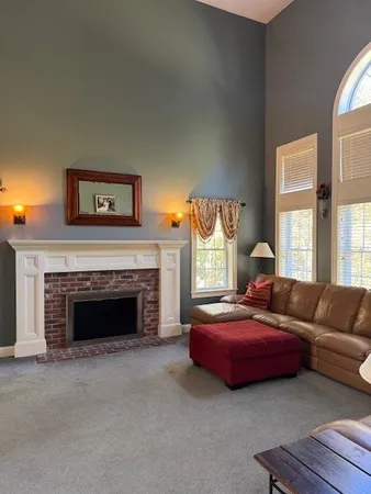 a bedroom with a bed and a fireplace