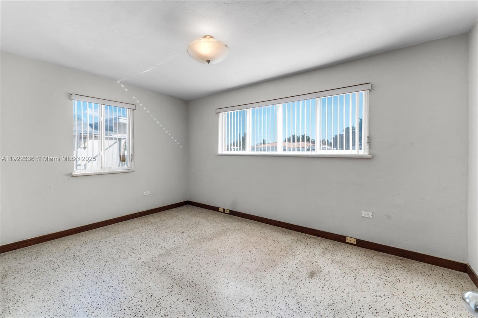 6841 Southwest 1st Street Miami, FL 33144 - Photo 12 of 30 an empty room with windows