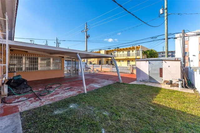 a view of a porch and garden