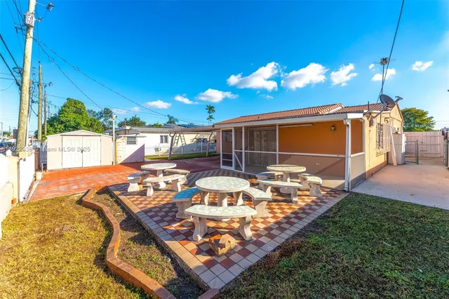a view of yard with patio