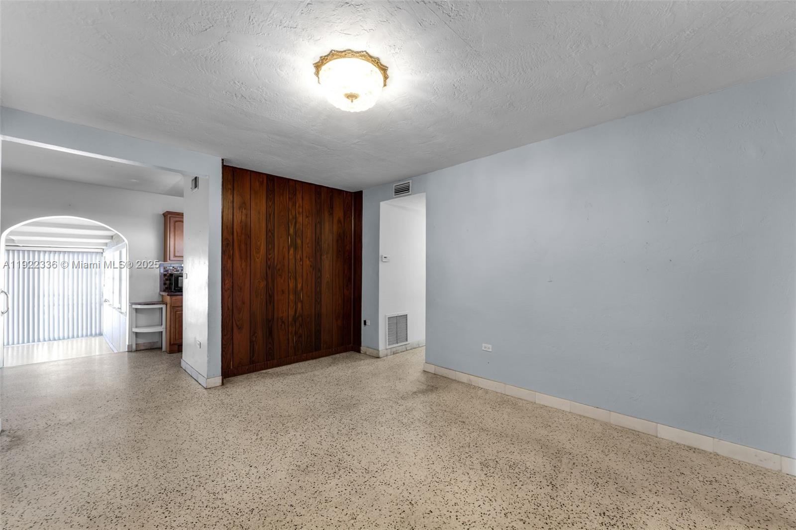 6841 Southwest 1st Street Miami, FL 33144 - Photo 4 of 30 an empty room with windows and closet