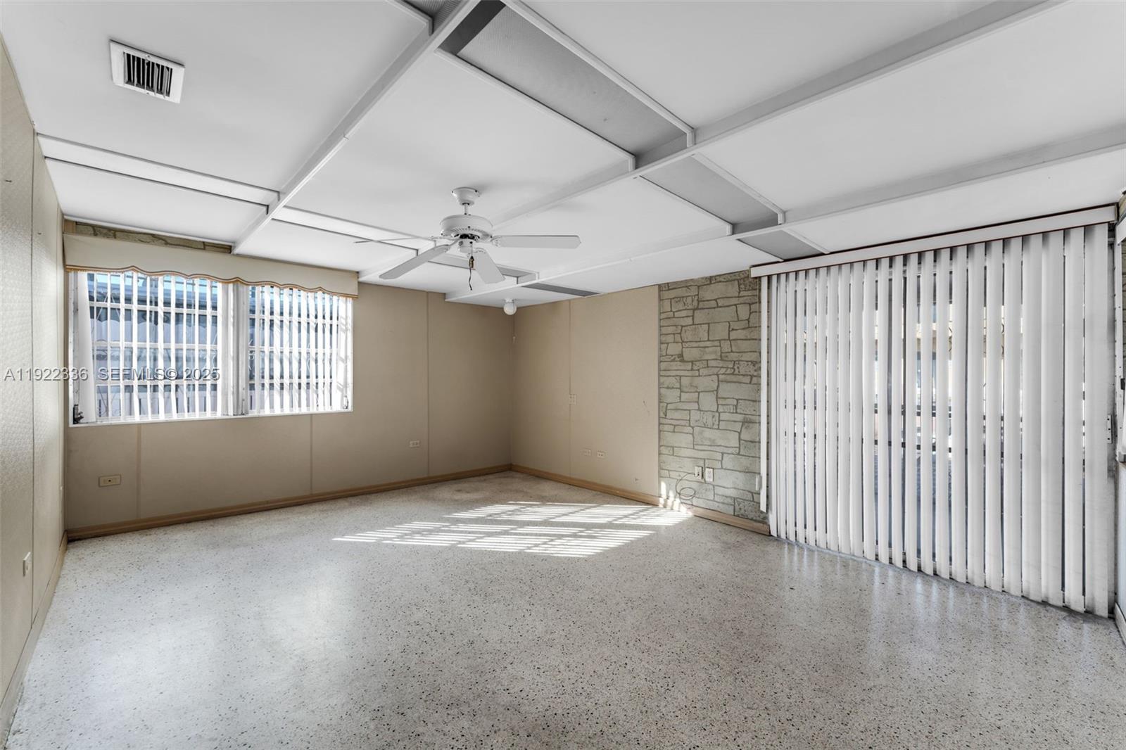 6841 Southwest 1st Street Miami, FL 33144 - Photo 10 of 30 a view of an empty room with a window