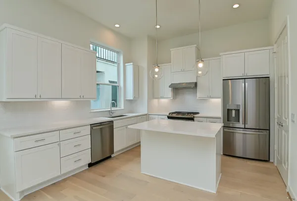 a view of a dining room with furniture wooden floor and a chandelier
