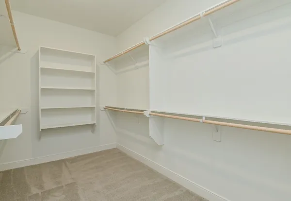 a view of an empty walk in closet