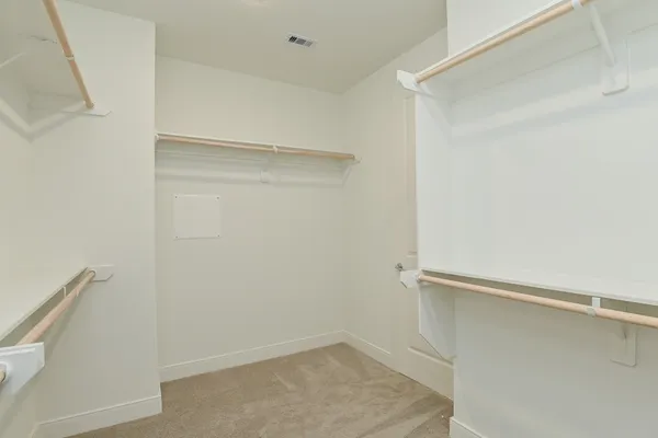 a view of an empty walk in closet
