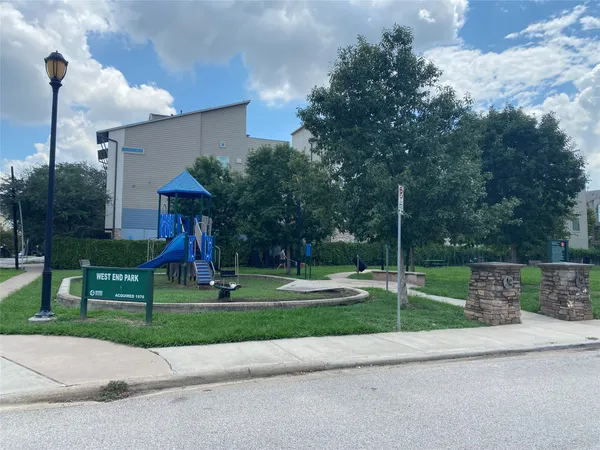 a childrens park with lots of trees and plants