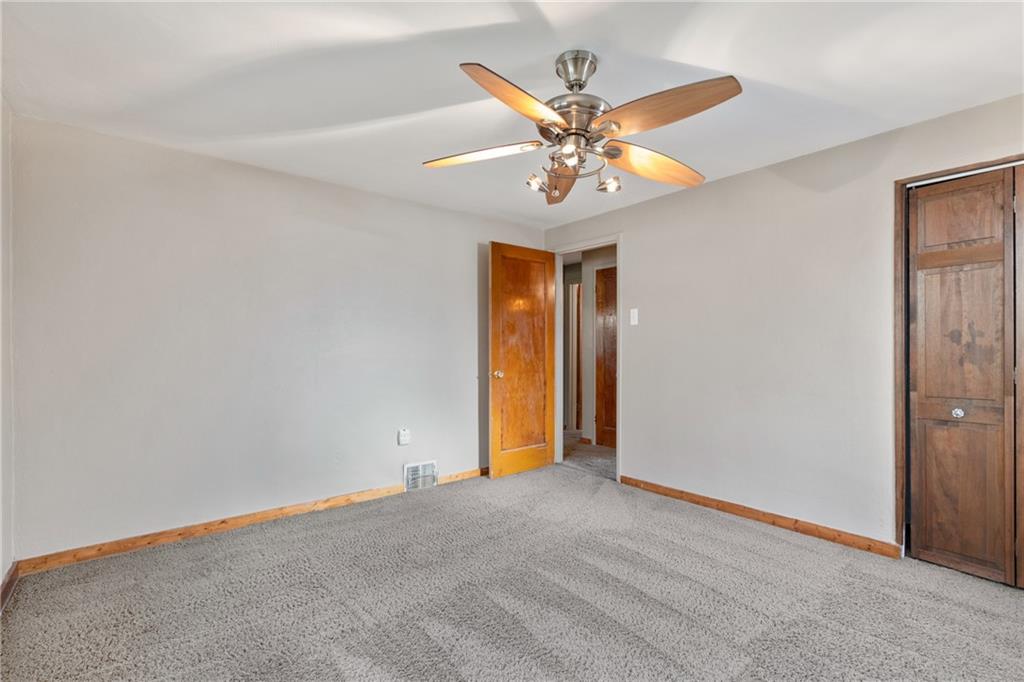 459 East Garden Road Pittsburgh, PA 15227 - Photo 14 of 33 an empty room with a chandelier fan and a chandelier fan