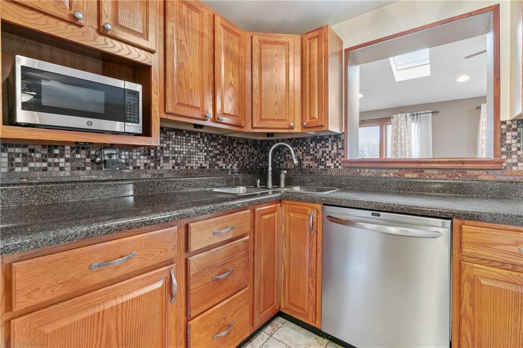 459 East Garden Road Pittsburgh, PA 15227 - Photo 6 of 33 a kitchen with stainless steel appliances granite countertop white cabinets and a sink