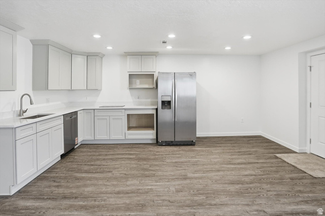 3636 West 910 South Syracuse, UT 84075 - Photo 48 of 70 Kitchenette featuring light-toned cabinetry, stainless steel refrigerator, and wood-finish flooring