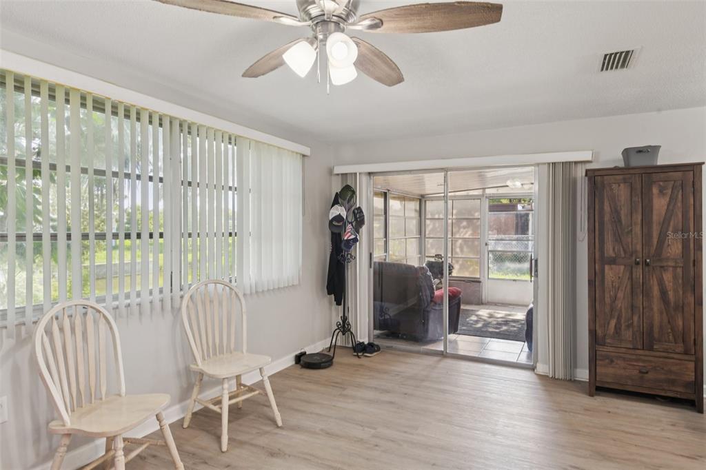 7102 Cherry Laurel Drive Port Richey, FL 34668 - Photo 13 of 39 a view of a room with furniture and wooden floor