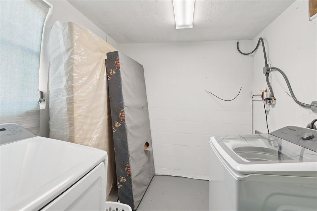 7102 Cherry Laurel Drive Port Richey, FL 34668 - Photo 25 of 39 a bathroom with a sink and a mirror